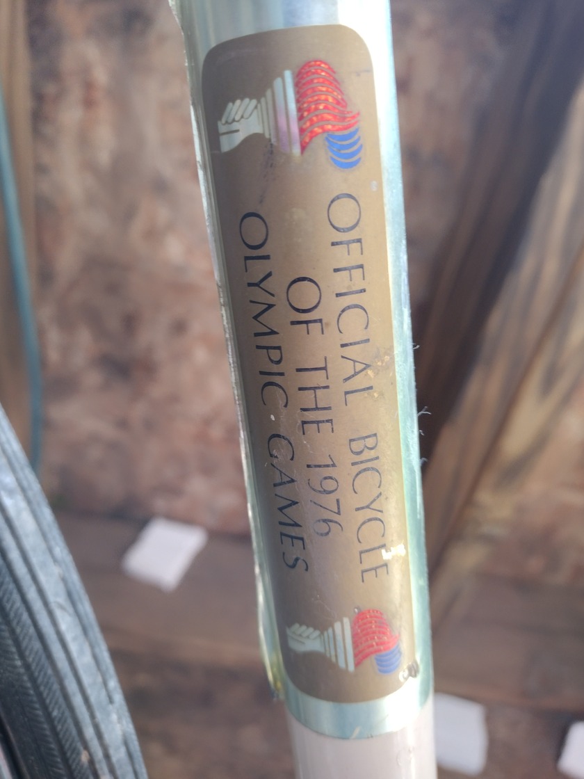 Decal sticker on old bike that says official bike of the olympic races